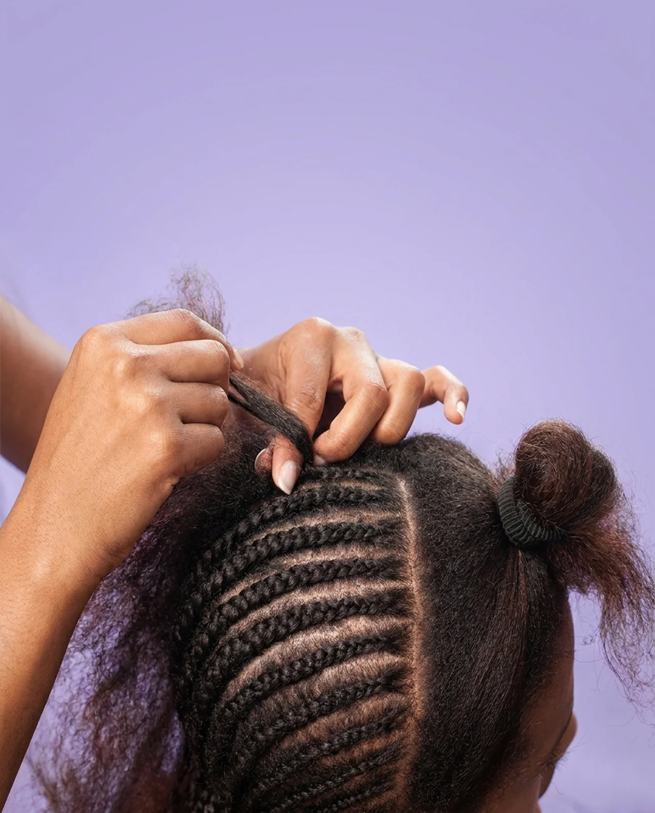 Hands sectioning hair with clean, straight parts using PERFECT PART
